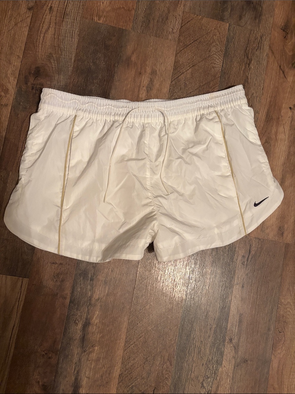 Nike Women's Cream Athletic Shorts with Black Swoosh